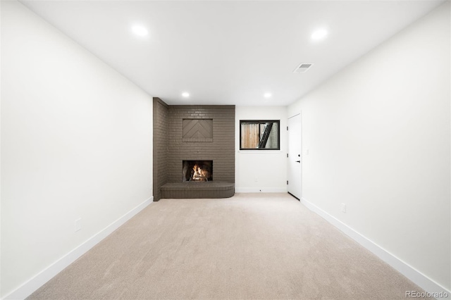 655 Cree Cir, Boulder, CO 80303 - unfurnished living room with recessed lighting, a brick fireplace, and light colored carpet