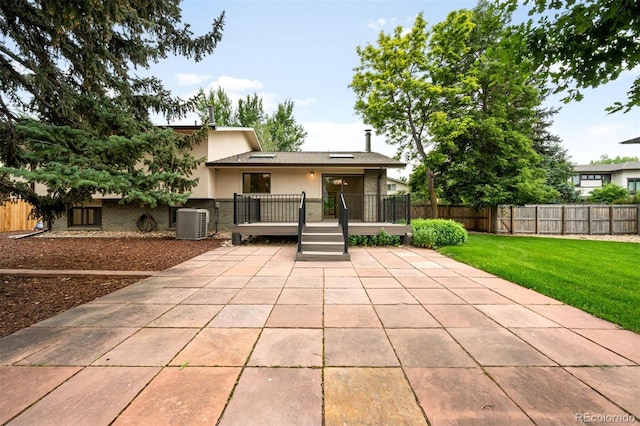 655 Cree Cir, Boulder, CO 80303 - rear view of property with a patio, stucco siding, and a wooden deck