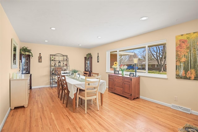 dining space featuring light wood-type flooring