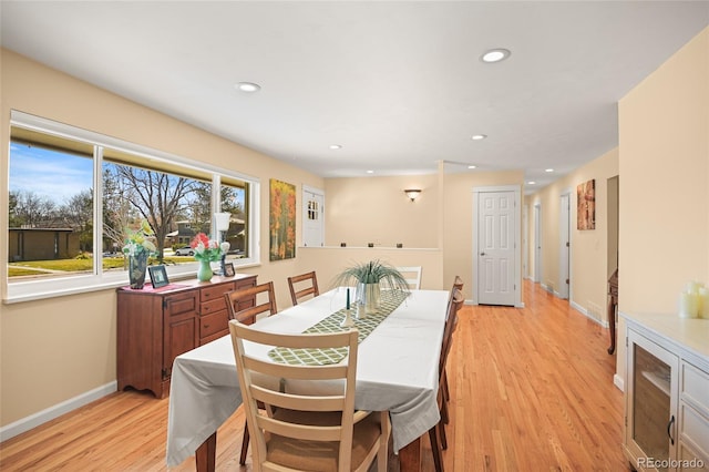 dining space featuring light wood-type flooring