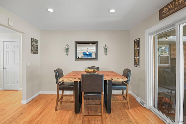 dining area featuring light wood-type flooring