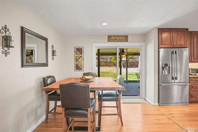 dining space with light hardwood / wood-style floors