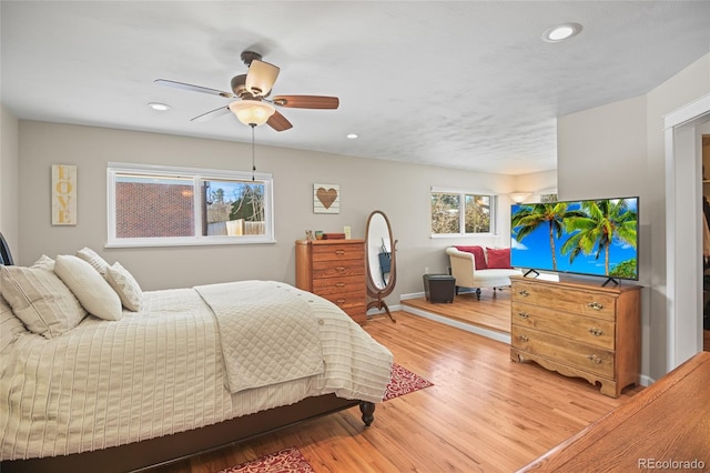 bedroom featuring ceiling fan and hardwood / wood-style floors