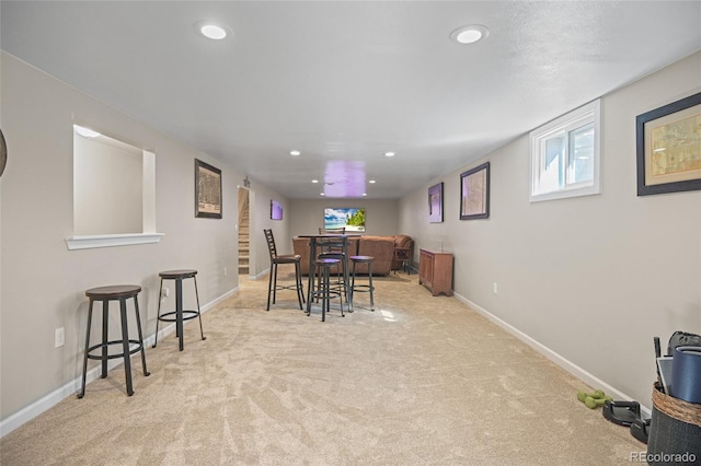 dining area featuring light colored carpet