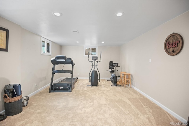 exercise room with light carpet