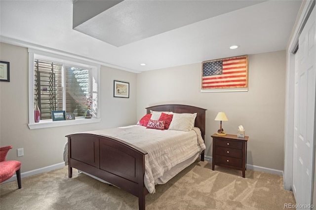 carpeted bedroom with a closet