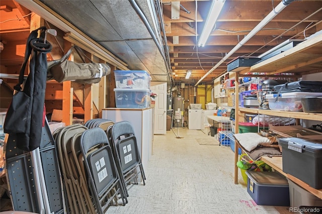 basement with washing machine and clothes dryer and water heater