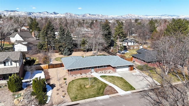 birds eye view of property featuring a mountain view