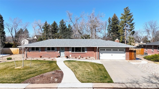 ranch-style home with a front yard and a garage