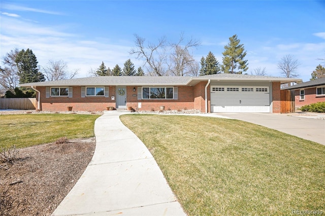 ranch-style home with a front lawn and a garage