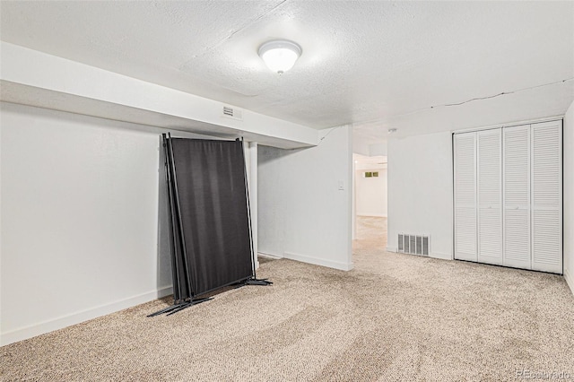 3715 Manchester St, Colorado Springs, CO 80907 - finished below grade area featuring carpet, a textured ceiling, and baseboards