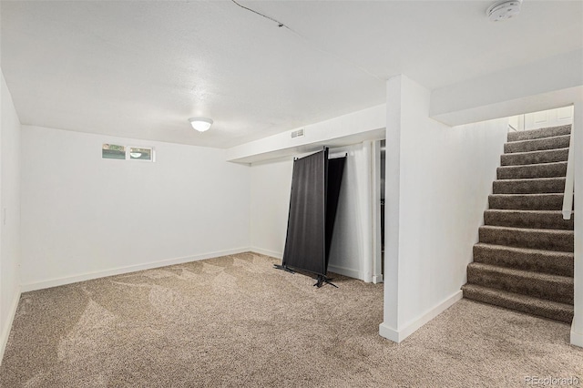 3715 Manchester St, Colorado Springs, CO 80907 - below grade area with carpet, baseboards, and stairway