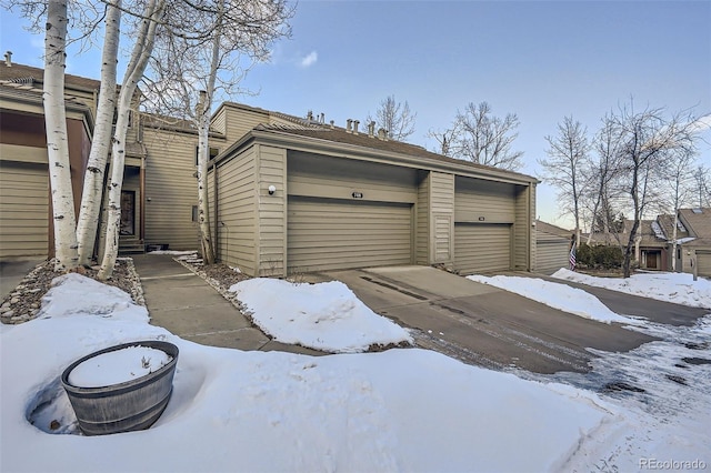 view of snow covered garage