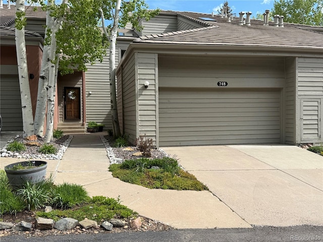 748 Ridgeside Dr, Golden, CO 80401 - entrance to property with a garage and concrete driveway