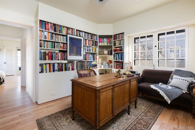 office space with light wood finished floors