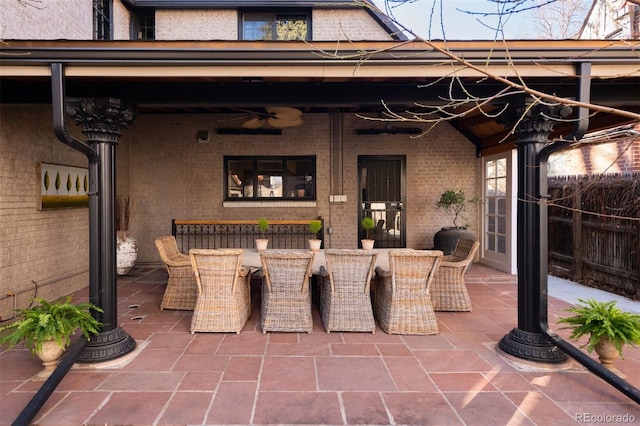 view of patio featuring fence and outdoor dining area