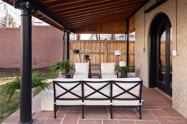 view of patio / terrace with fence and an outdoor hangout area