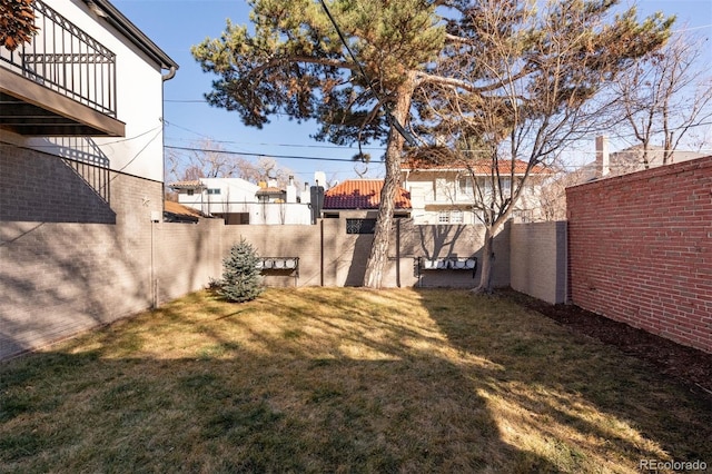 view of yard with a fenced backyard