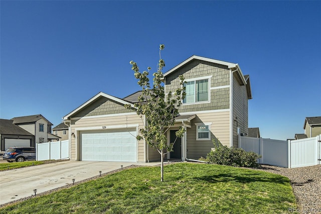 view of front of house with a garage and a front yard