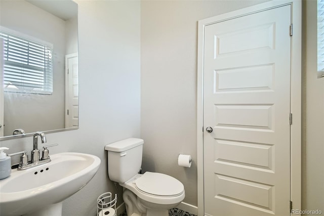 bathroom featuring sink and toilet