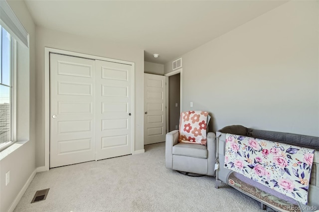 living area featuring light colored carpet