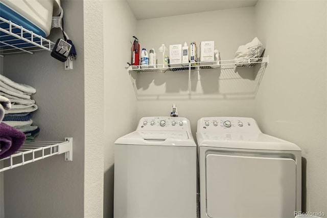 washroom featuring washer and clothes dryer