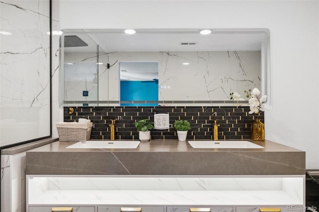 bathroom featuring vanity, walk in shower, and backsplash