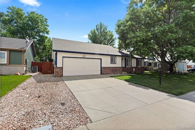 4421 Sunshine Cir, Loveland, CO 80538 - single story home with brick siding, an attached garage, driveway, and central AC