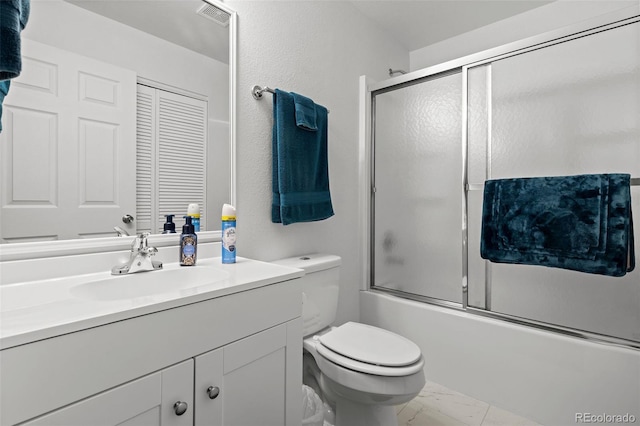 4421 Sunshine Cir, Loveland, CO 80538 - bathroom featuring marble finish flooring, vanity, toilet, and shower / bath combination with glass door