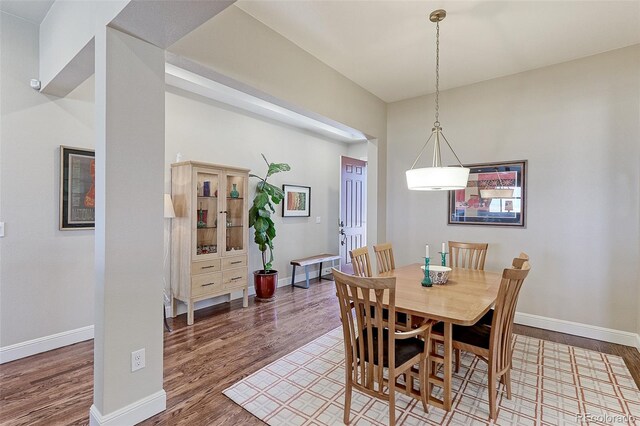 dining space featuring hardwood / wood-style floors