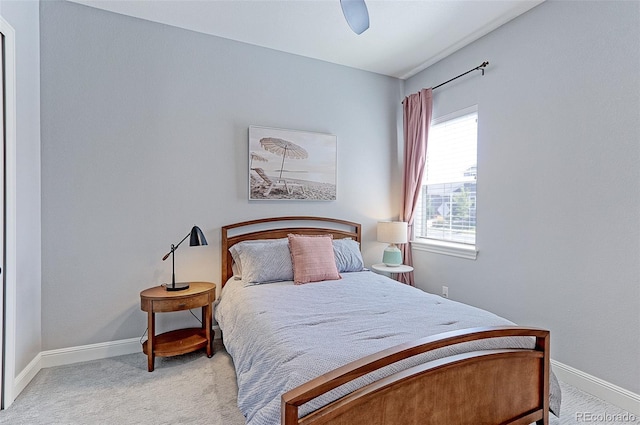 bedroom with ceiling fan and light colored carpet