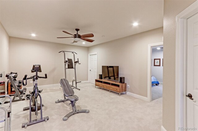 exercise room featuring ceiling fan and light carpet