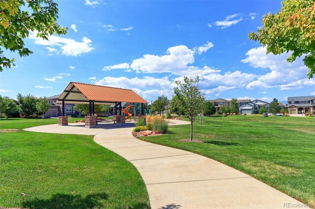 view of property's community with a yard and a gazebo