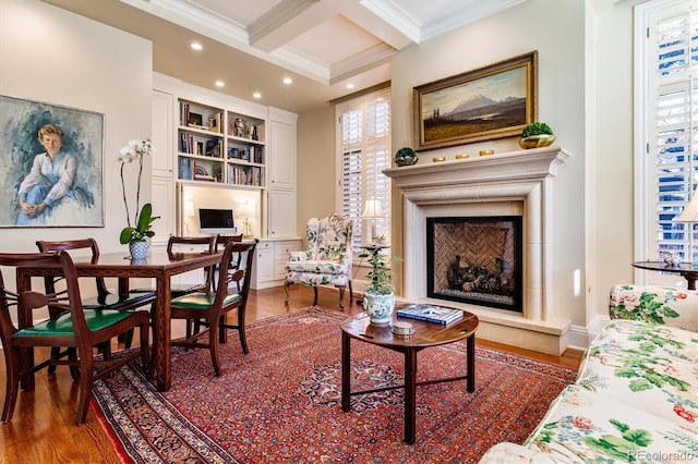 living area featuring coffered ceiling, dark hardwood / wood-style flooring, beam ceiling, and a wealth of natural light