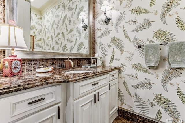 bathroom featuring tasteful backsplash and vanity