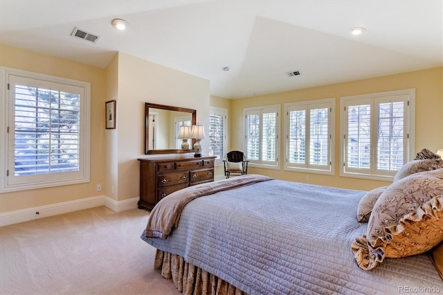 carpeted bedroom featuring vaulted ceiling