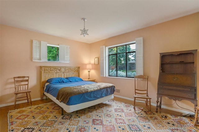 2309 E Floyd Pl, Englewood, CO 80113 - bedroom with baseboards and wood finished floors