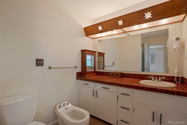 2309 E Floyd Pl, Englewood, CO 80113 - bathroom featuring vanity and a bidet