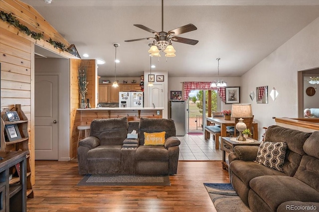 1176 E Purcell Ln, Pueblo, CO 81007 - living room with lofted ceiling, a ceiling fan, wood finished floors, and a chandelier