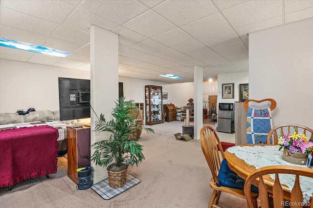 1176 E Purcell Ln, Pueblo, CO 81007 - dining room featuring carpet and a drop ceiling