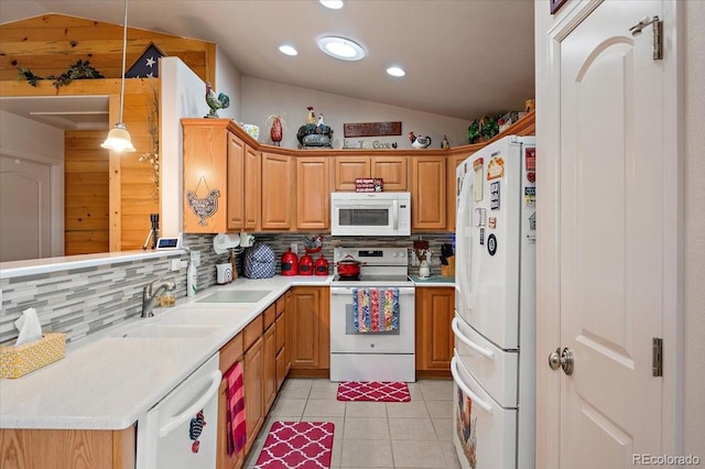 1176 E Purcell Ln, Pueblo, CO 81007 - kitchen featuring white appliances, lofted ceiling, decorative backsplash, light countertops, and light tile patterned flooring