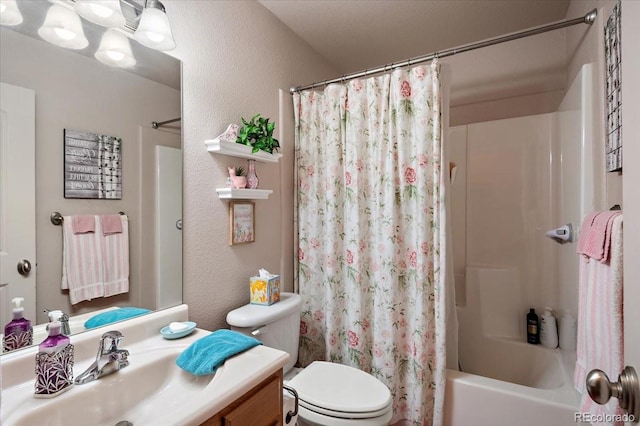 1176 E Purcell Ln, Pueblo, CO 81007 - bathroom with toilet, vanity, shower / tub combo, and a textured wall