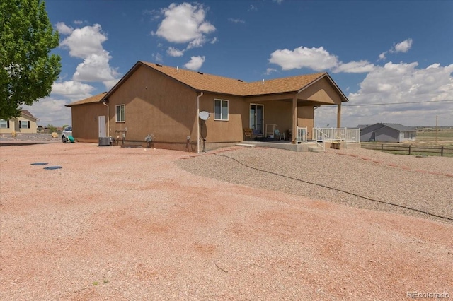 1176 E Purcell Ln, Pueblo, CO 81007 - back of property with a porch and central air condition unit