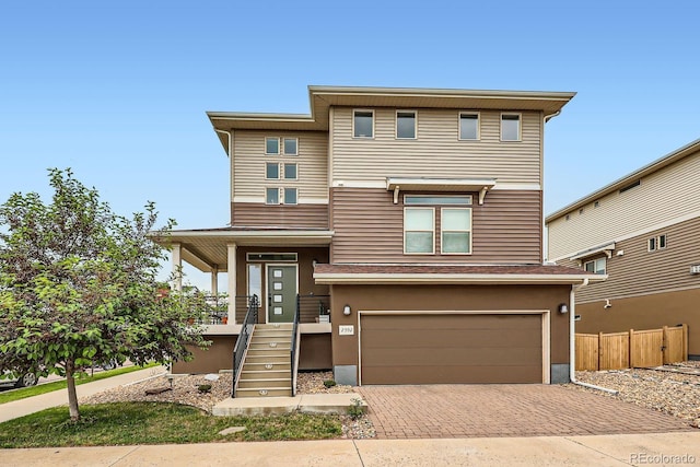 2592 Sweet Wind Ave, Castle Rock, CO 80109 - view of front facade featuring decorative driveway and an attached garage