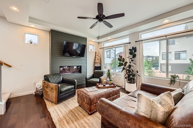 2592 Sweet Wind Ave, Castle Rock, CO 80109 - living area featuring recessed lighting, wood finished floors, healthy amount of natural light, and a raised ceiling