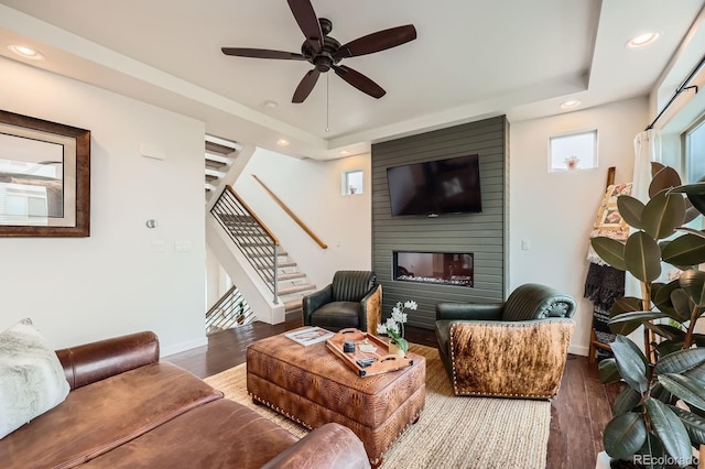 2592 Sweet Wind Ave, Castle Rock, CO 80109 - living room featuring stairs, recessed lighting, wood finished floors, a fireplace, and ceiling fan