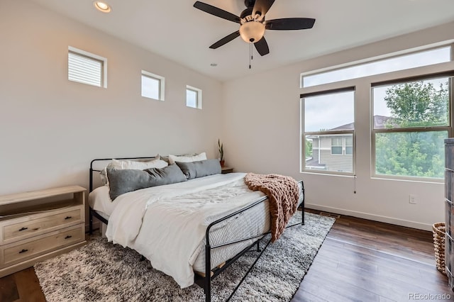 2592 Sweet Wind Ave, Castle Rock, CO 80109 - bedroom with multiple windows, dark wood-style floors, recessed lighting, and ceiling fan