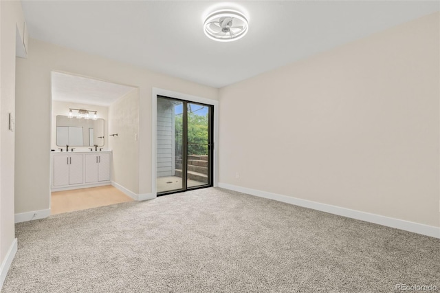 3141 S Tamarac Dr Unit 111G, Denver, CO 80231 - unfurnished bedroom featuring carpet, access to outside, and baseboards