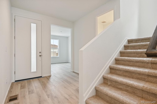 foyer with light hardwood / wood-style floors