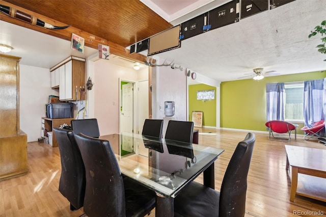 dining area featuring ceiling fan and light hardwood / wood-style flooring